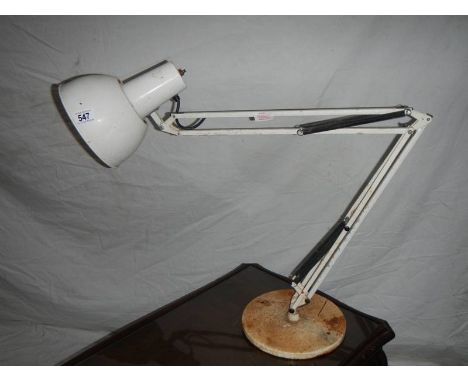 A large white angle poise lamp with weighted bottom.
