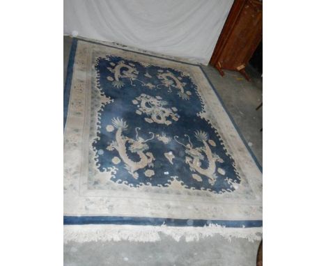 A 5 dragon plush carpet in good condition but needs a clean, approximately 2 x 3 m.