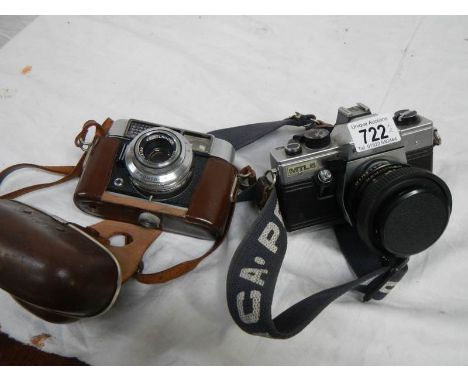 A Voigtlander camera and a Praktica MTLS camera.