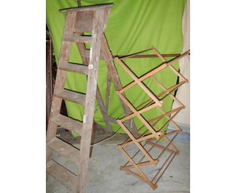 An old wooden step ladder and a clothes airer.