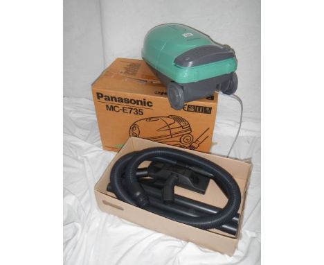 A new (still in box) Panasonic MC-E735 vacuum cleaner with all tools and extra bags.