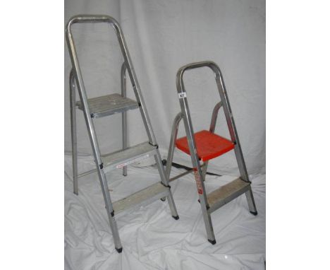 A two step and a three step aluminium ladder.