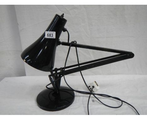 An anglepoise reading lamp in black.