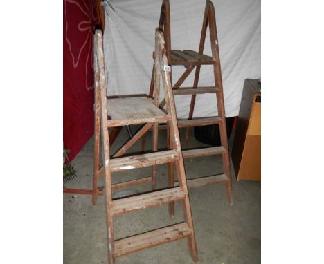 2 old wooden step ladders.