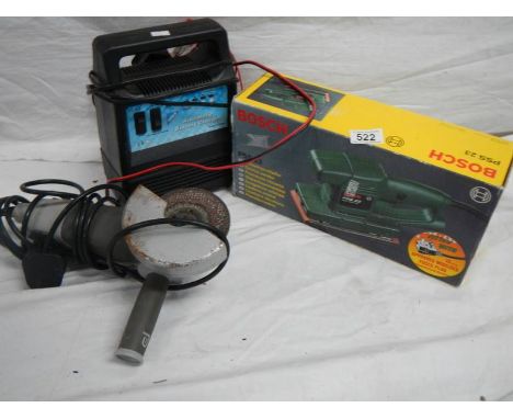 A Bosch PS23 sander, an angle grinder and a battery charger.