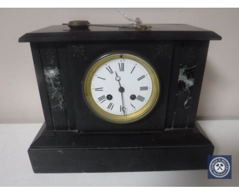 A Victorian slate and marble mantel clock with enamel dial, with pendulum and key