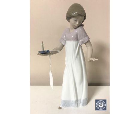 A Nao figurine - Girl holding candle, height 26 cm.