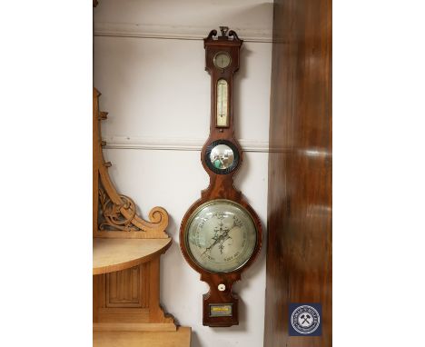 A late nineteenth century banjo barometer, silvered dial signed C. Riva, Glasgow, height 110 cm.