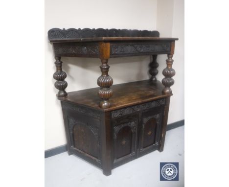 A carved oak buffet sideboard 