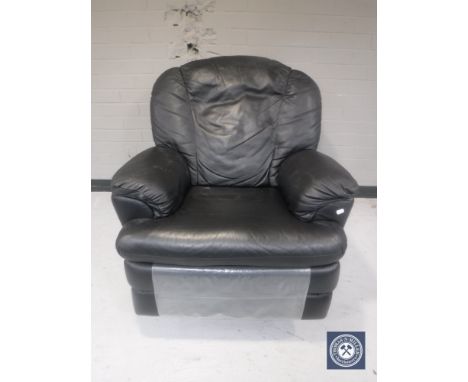 A black leather manual reclining armchair 