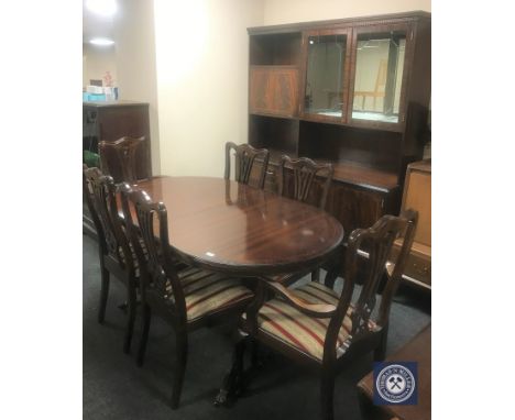 A ten-piece inlaid mahogany dining room suite comprising of display unit, oval extending dining table, set of six chairs, a t