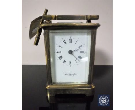 A brass cased Wellington carriage clock with key