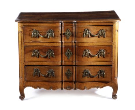 A FRENCH LOUIS XV PROVINCIAL WALNUT COMMODE C.1760-70 of arc d'arbalete shape with three long drawers and scroll feet 82cm hi