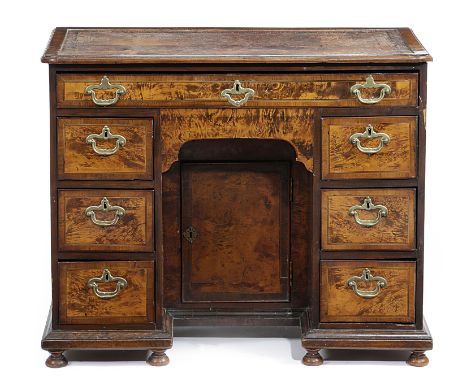 A DIMINUTIVE GEORGE I 'MULBERRY' KNEEHOLE DESK EARLY 18TH CENTURY AND LATER with stained burr maple veneers, the moulded edge