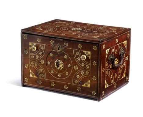 AN INDIAN HARDWOOD BONE AND IVORY TABLE CABINET 18TH CENTURY inlaid with flowerheads, the fall front revealing an arrangement