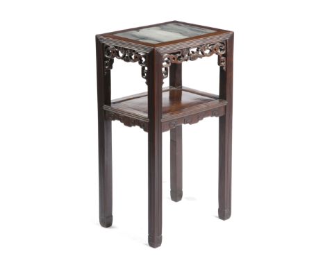 A CHINESE HARDWOOD STAND LATE 19TH CENTURY the top inset with a marble panel, with fret carved decoration on reeded supports 