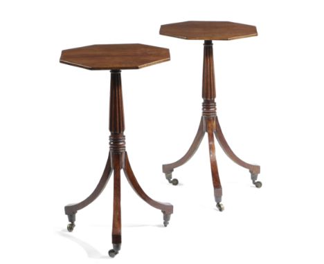 A PAIR OF MAHOGANY LAMP TABLES EARLY 19TH CENTURY AND LATER each with an octagonal fixed top on a ribbed stem and brass casto