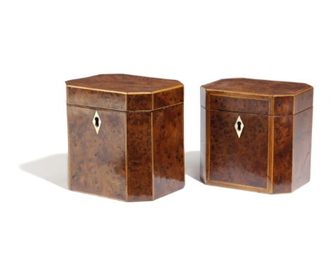 A GEORGE III BURR WALNUT TEA CADDY LATE 18TH CENTURY of canted rectangular form with a bone escutcheon, the single canister w