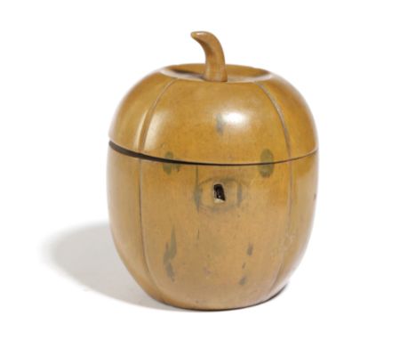 A TREEN FRUITWOOD TEA CADDY, IN THE FORM OF A MELON MID-19TH CENTURY naturalistically carved and with remains of a green stai