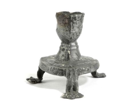 A MEDIEVAL PEWTER VOTIVE OR PILGRIM'S CANDLESTICK PROBABLY ENGLISH, 13TH / 14TH CENTURY the ogee shaped holder on a circular 