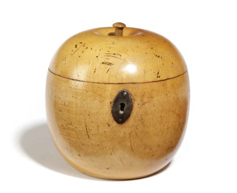 A TREEN FRUITWOOD TEA CADDY IN THE FORM OF AN APPLE EARLY 19TH CENTURY with a stalk finial, navette shaped steel escutcheon a