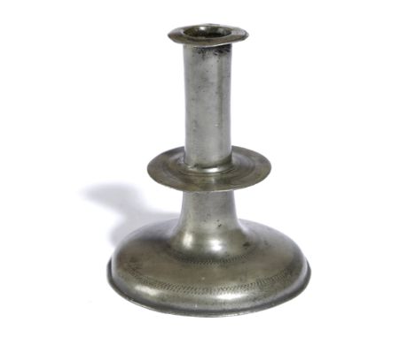 A COMMONWEALTH PEWTER TRUMPET CANDLESTICK MID-17TH CENTURY with banded decoration to the neck, drip-tray and foot, with a  'T