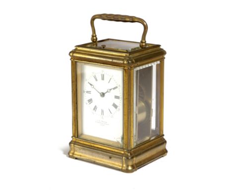 A FRENCH GILT BRASS CARRIAGE CLOCK RETAILED BY W. BENSON, LTD, LONDON the brass eight day movement with repeater mechanism an