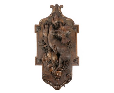 A BLACK FOREST LINDEN WOOD HUNTING TROPHY PLAQUE LATE 19TH CENTURY carved with a deer, pheasant, hare, other game and hunting