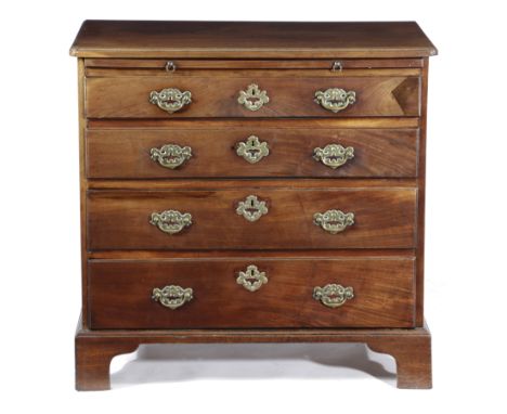A GEORGE II MAHOGANY BACHELOR'S CHEST C.1740 with a caddy moulded edge top above a brushing slide and four long drawers, fitt