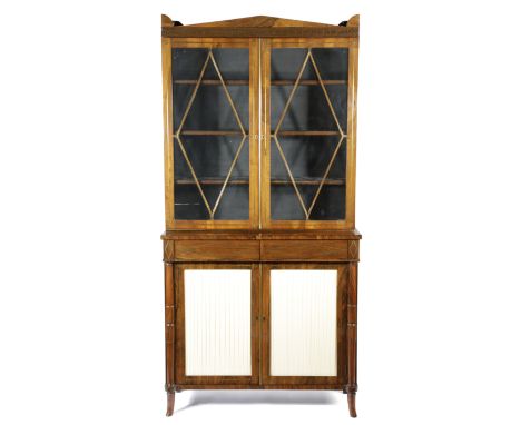 A REGENCY ROSEWOOD AND BRASS BOOKCASE C.1815-20 inlaid with scrolling leaves and arrowhead stringing, the detachable cornice 