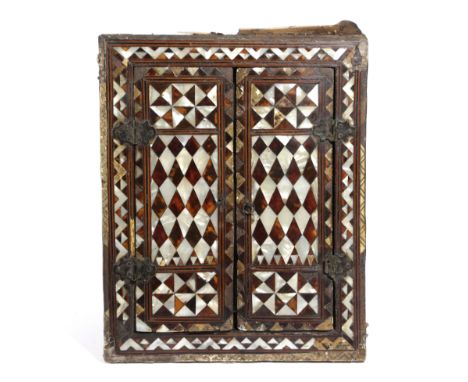AN OTTOMAN TORTOISESHELL AND MOTHER OF PEARL ENCLOSED MIRROR TURKISH, 18TH CENTURY with a pair of doors enclosing a rectangul