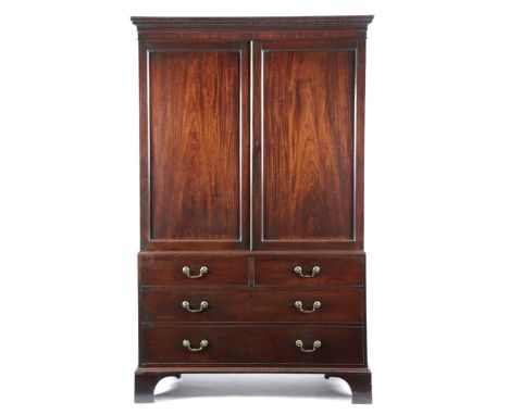 AN EARLY GEORGE III MAHOGANY LINEN PRESS CHIPPENDALE PERIOD, C.1770 the detachable dentil cornice above a pair of panelled do