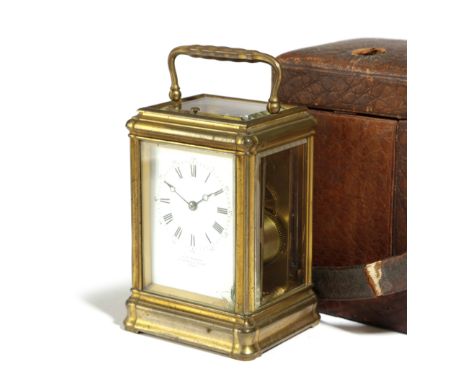 A FRENCH GILT BRASS CARRIAGE CLOCK RETAILED BY J.W.BENSON, LATE 19TH CENTURY the brass eight day repeating movement striking 
