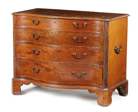 A GEORGE III MAHOGANY SERPENTINE COMMODE C.1770-1780 the moulded edge top above four long fiddleback mahogany drawers flanked