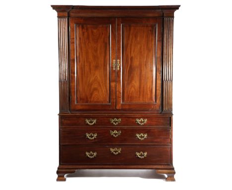 A GEORGE II MAHOGANY LINEN PRESS IN THE MANNER OF GILLOWS, NORTH COUNTRY, MID-18TH CENTURY with a pair of fielded panel doors