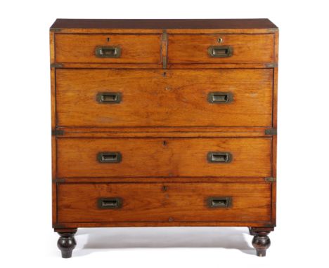 A VICTORIAN TEAK CAMPAIGN CHEST BY ARMY &amp; NAVY, LATE 19TH CENTURY in two halves, with two short and three long drawers wi