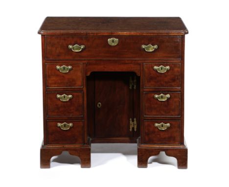 A GEORGE II MAHOGANY KNEEHOLE SECRETAIRE DESK C.1740-50 the caddy moulded top with re-entrant front corners above a secretair