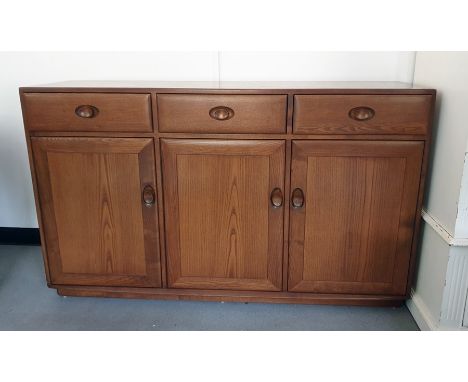 A 20th Century Ercol elm sideboard and tv unitCondition ReportSmall chips to the back, shelf missing from tv unit, small chip