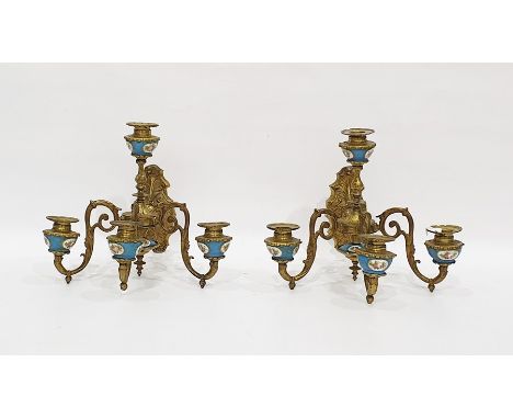 Pair of brass and porcelain-mounted wall lights each four-branch light mounted with Sevres-style blue ground sconces, with le