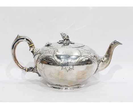 Victorian silver bullet-shaped teapot with floral engraving, pomegranate finial, raised on a circular base, London 1857, make