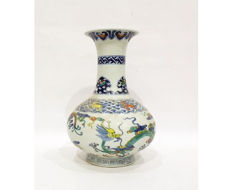 Chinese porcelain doucai vase, oviform with flared neck, decorated with dragons amongst clouds and scrolls, the neck decorate