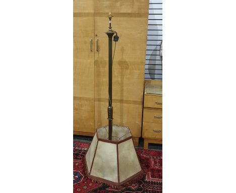 Brass bodied standard lamp with reeded column, circular base and three paw feet