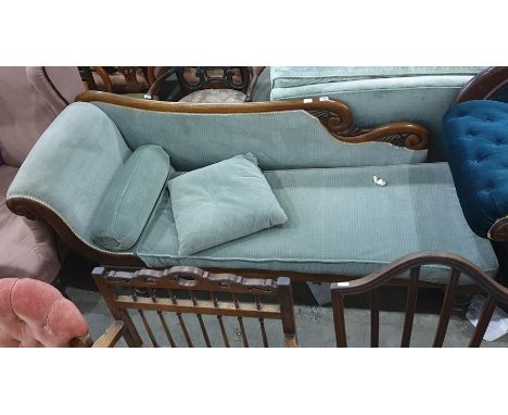 19th century mahogany chaise longue in a light blue ground upholstery, turned supports