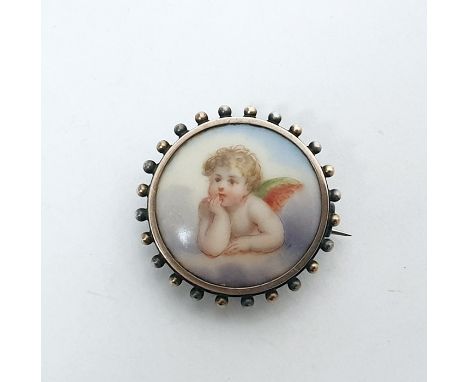 Silver, gold-plated and porcelain brooch, circular, decorated with cherub to the porcelain plaque Condition ReportSmall dotte