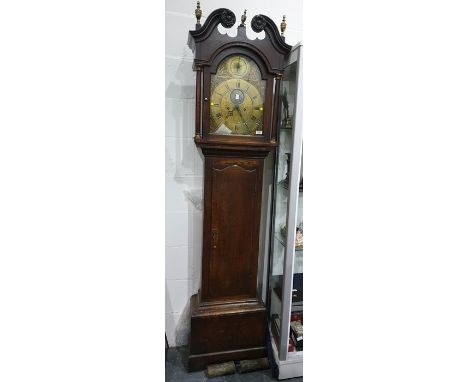 George III oak longcase clock by Henry Bunyan, Lincoln, the hood with swan neck pediment, flowerhead carved roundels surmount