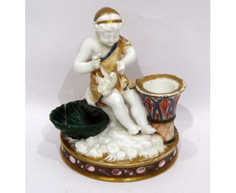 Mid 19th century English porcelain candlestick-inkstand modelled as a scantily draped figure with a dove beside a shell-shape