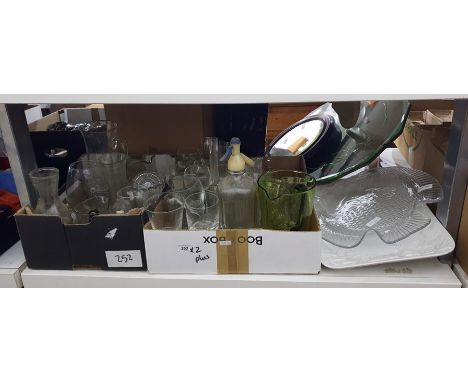 Two boxes of mixed glassware including jugs, green stemmed hock glasses, vintage soda syphon and a large fish-shaped glass pl