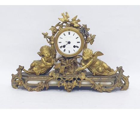 20th century ormolu mantel clock, the drum-shaped case with white enamel dial, inscribed "Martin Baskett &amp; Co, Cheltenham