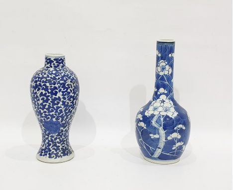 Two Chinese blue and white vases, blue four-character marks, the first of inverted baluster shape painted with continuous scr