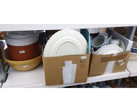 Two boxes of mixed ceramics to include Amstel beer steins, a ceramic bread bin and mixing bowl, various plates and other tabl